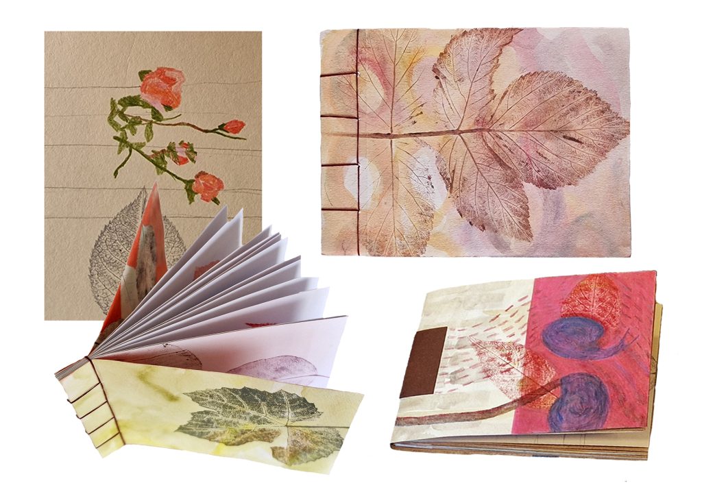 Zelfgemaakte boekjes van papier met bloemenprints, gemaakt tijdens de workshop.